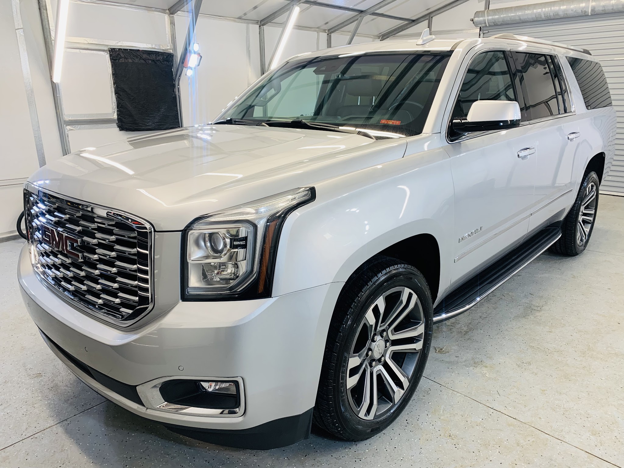 Silver GMC Yukon XL after a full detail